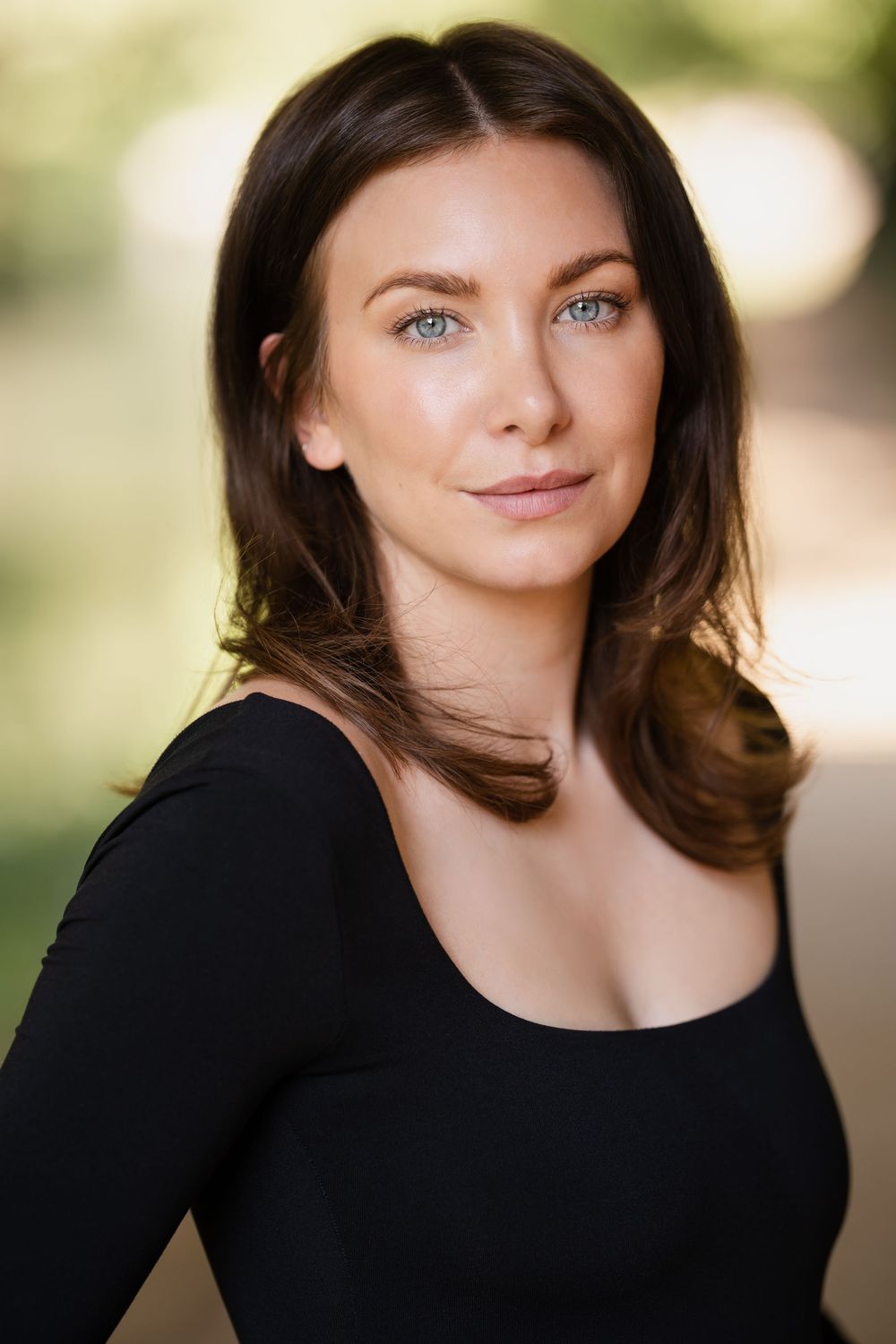 Professional headshots of a woman in a black top against a soft blurred background.