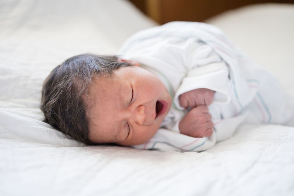 Newborn baby  yawning during her Fresh 48 session at Fort Sanders Medical Center in Knoxville.