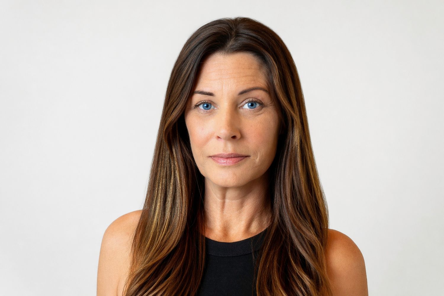 Studio professional headshot of a businesswoman against a light background