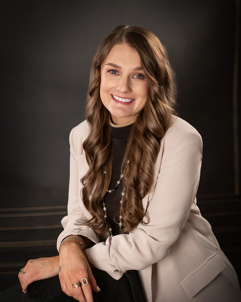 Executive corporate studio portrait of a woman in white jacket by headshot photographer Luba Wold in post Falls