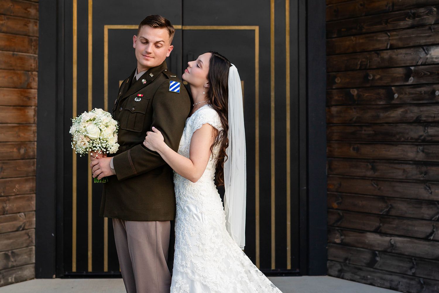 Bride and her groom in military dress uniform at their Osage House wedding in Cave Springs, Arkansas