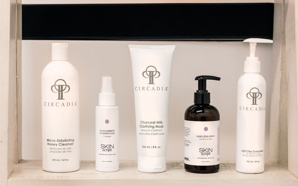 Five Circadia and Skin Script skincare products displayed on a shelf, including cleansers and a charcoal milk clarifying mask.