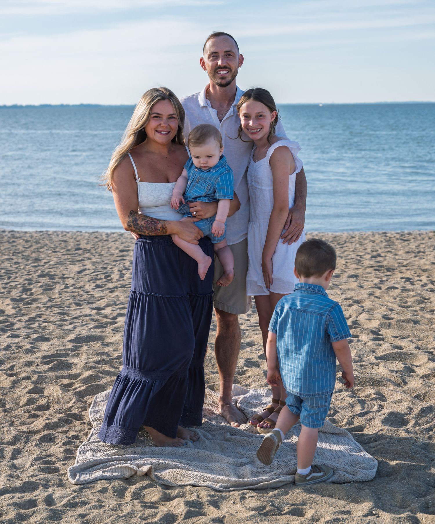A family on the beach.