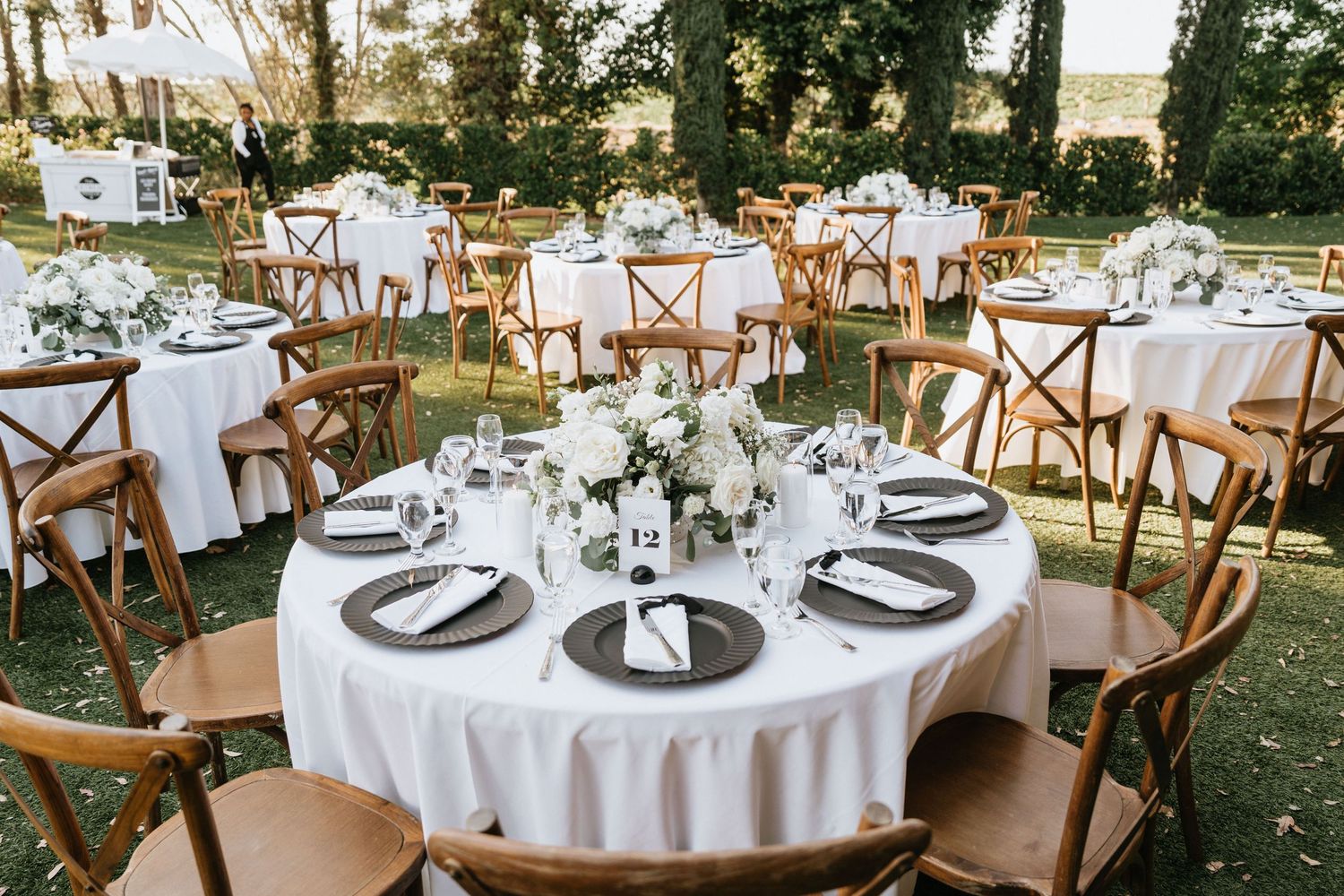 Falkner Winery reception tables arranged with white floral centerpieces