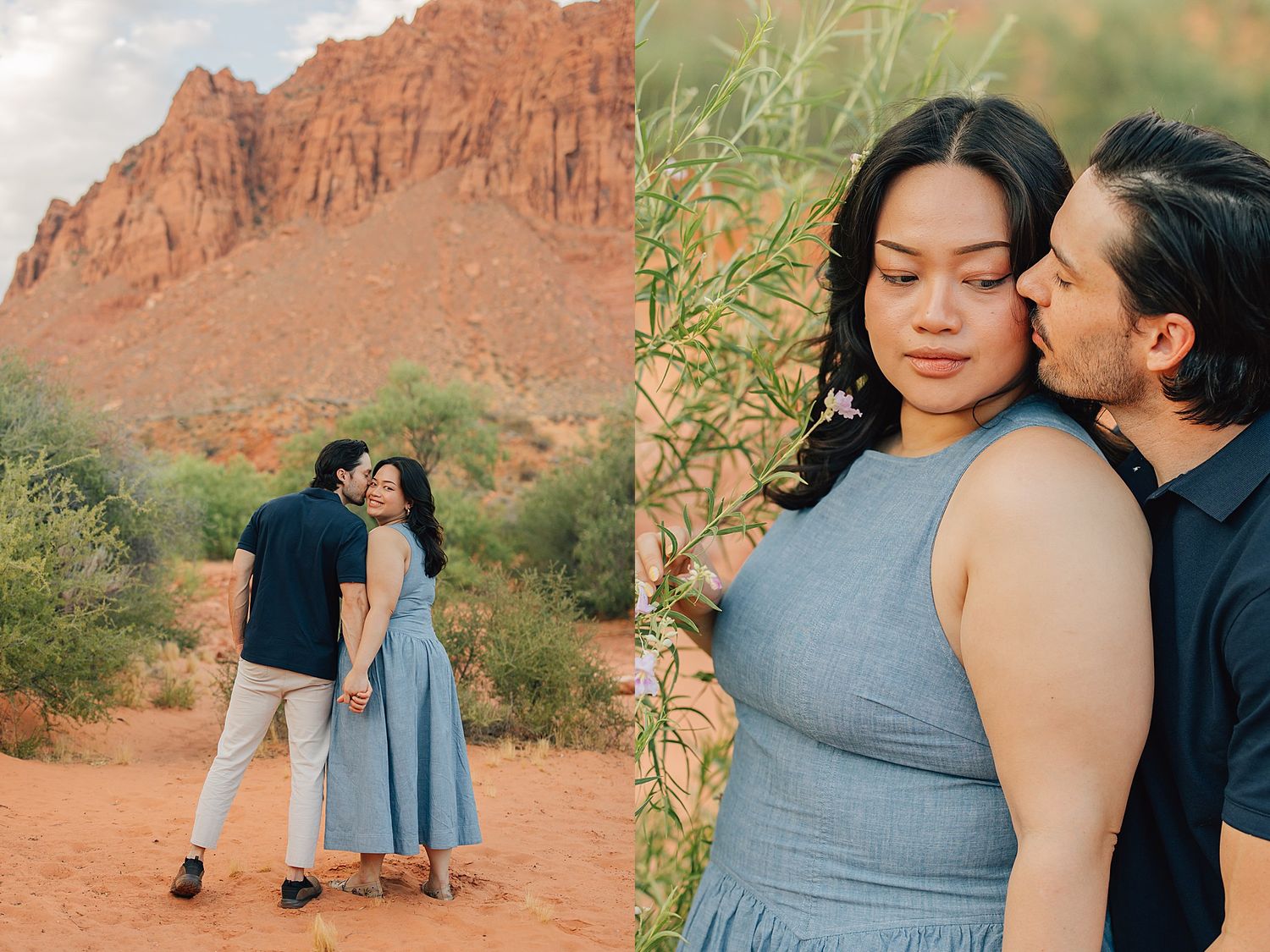 Couple embracing near red rock formations in the desert, woman in blue dress, man in navy shirt, romantic outdoor engagement photos.