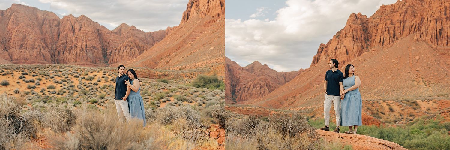 Couple embracing in front of red rock canyon landscape in the desert Southwest during an outdoor engagement photo session.