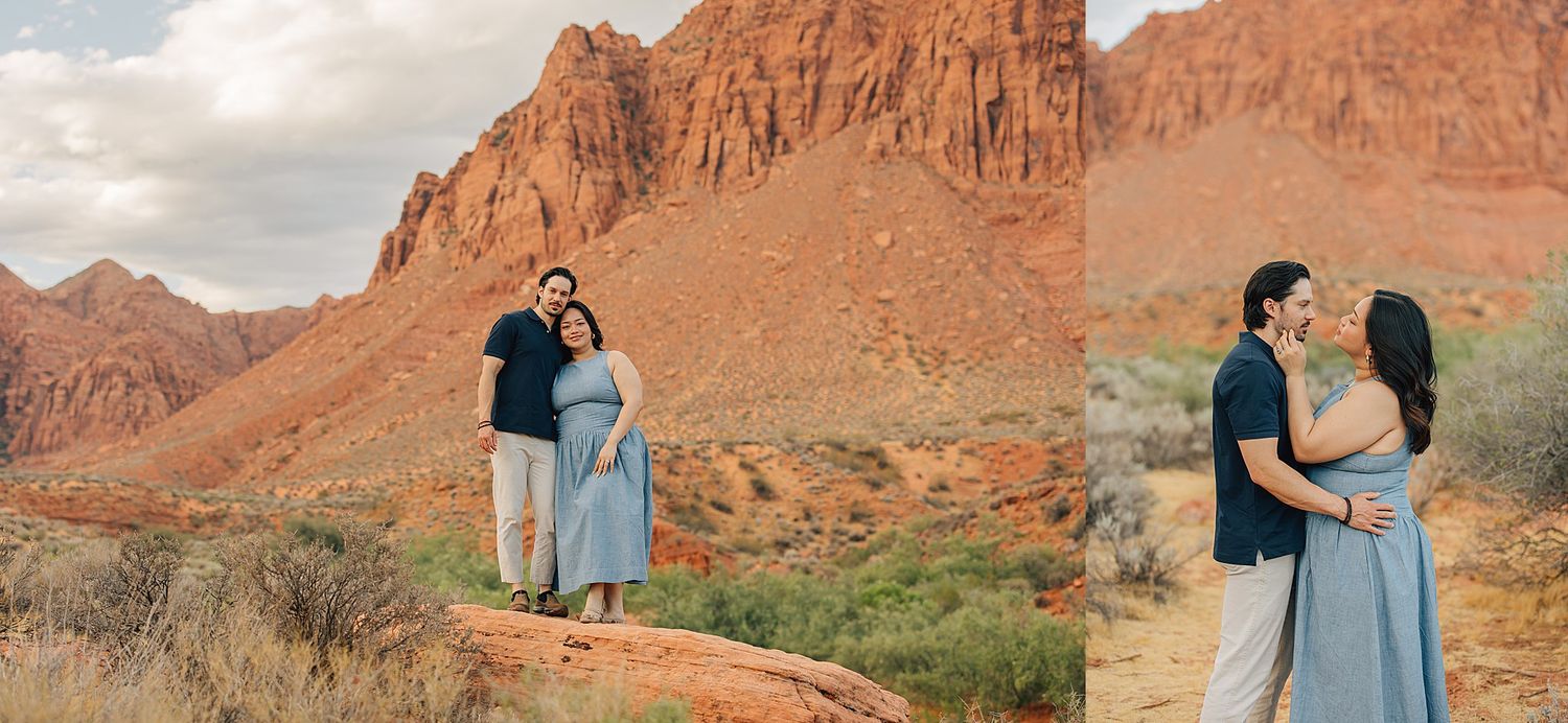 Couple posing together in front of stunning red rock canyon formations in a desert landscape.