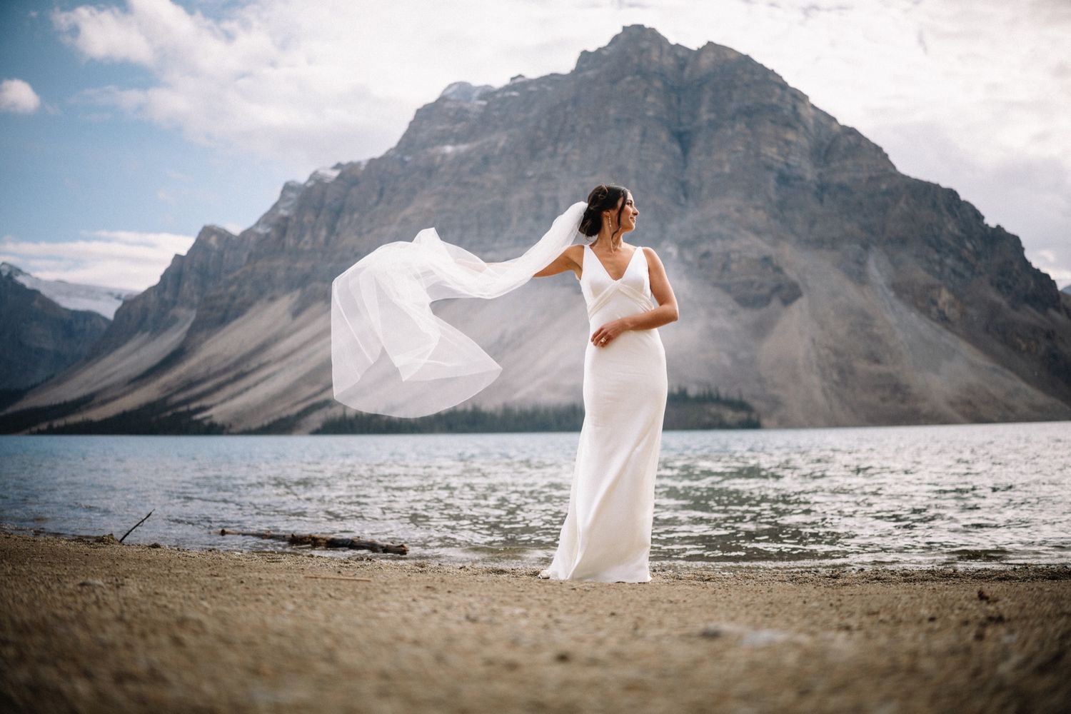 Bride's veil flying in front of the mountains at Bow Lake near Lake Louise