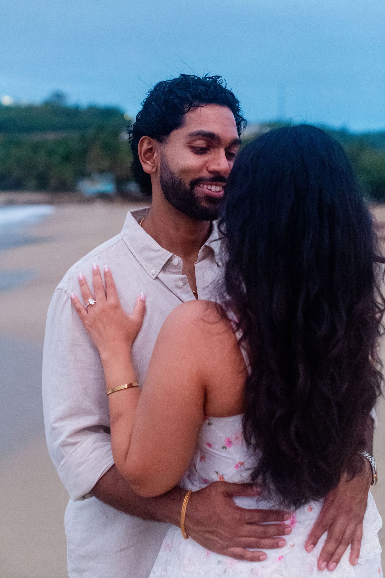 Engagement portrait on the beach. Man and woman embracing. Playa Guajataca, Isabela, Puerto Rico.