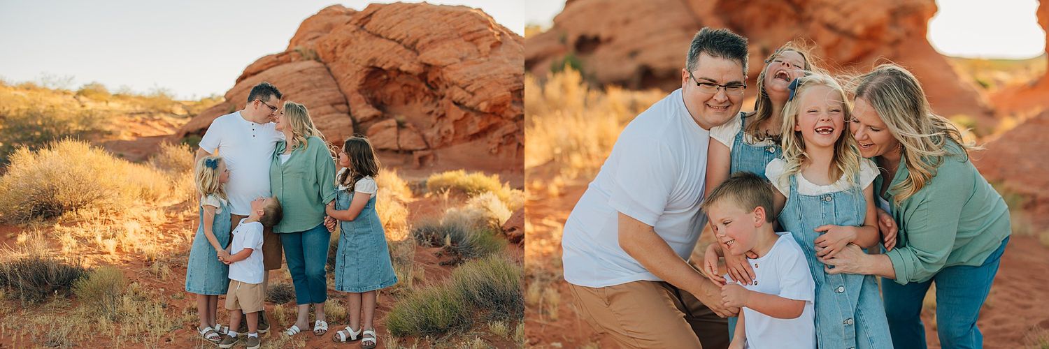 A family poses together in a desert landscape with red rock formations at golden hour in St. George, Utah.