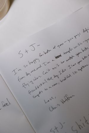 Handwritten wedding guest book note signed by Chris Hoffman congratulating couple S and J on their marriage.