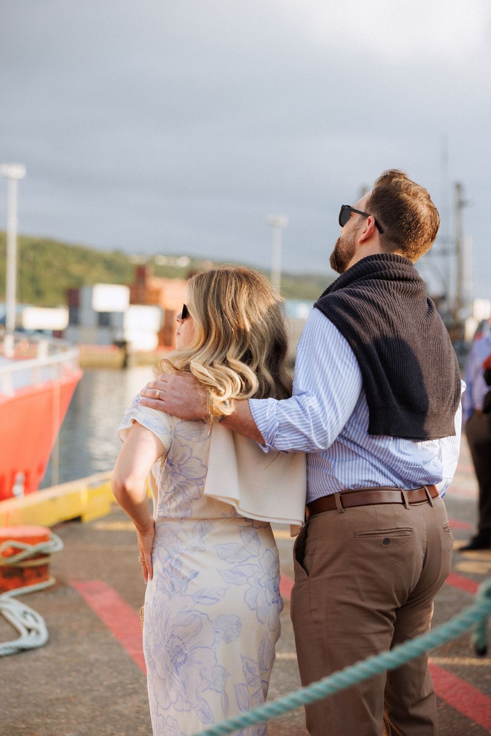 Candid wedding welcome party moments aboard a boat in Newfoundland by documentary wedding photographer Kaitlyn Yvette