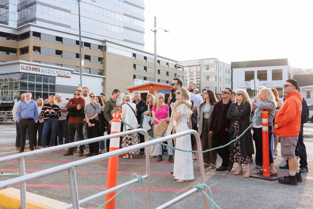 Candid wedding welcome party moments aboard a boat in Newfoundland by documentary wedding photographer Kaitlyn Yvette
