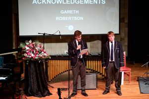 Students receiving recognition on stage during the St Alban’s music recital.