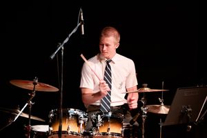 Young drummer captured mid-performance at the St Alban’s music recital.