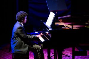 Young pianist performing on a grand piano during the St Alban’s music recital in Pretoria.
