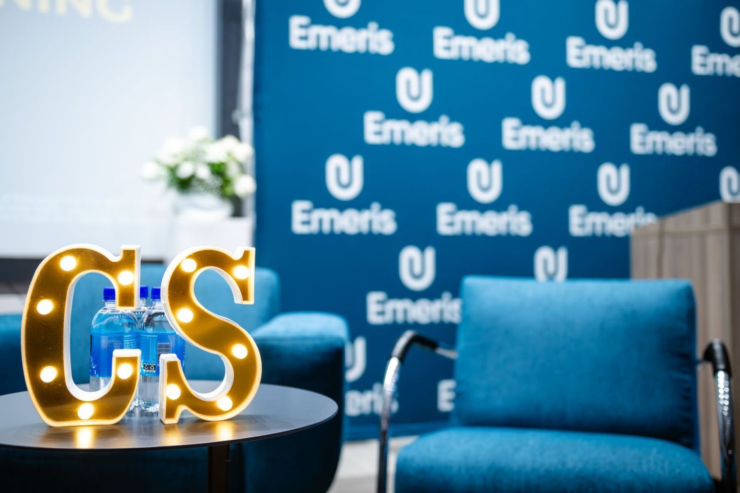 Branded stage setup and seating prepared for an event at Emeris Sandton Campus.