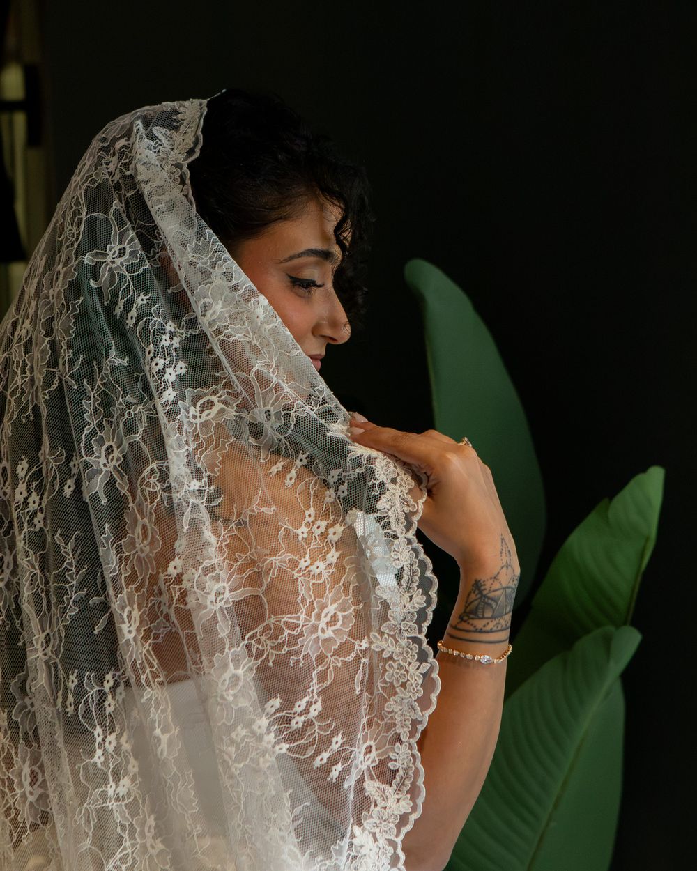 Gorgeous bride showing off her veil before her wedding by wedding photographer, Taylor LeAnn Photography.