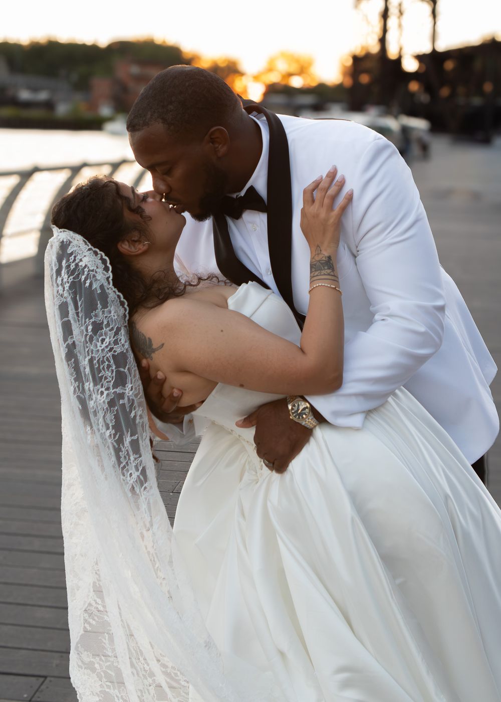 Bride and groom in Cleveland flats on sunset by wedding photographer, Taylor LeAnn Photography.