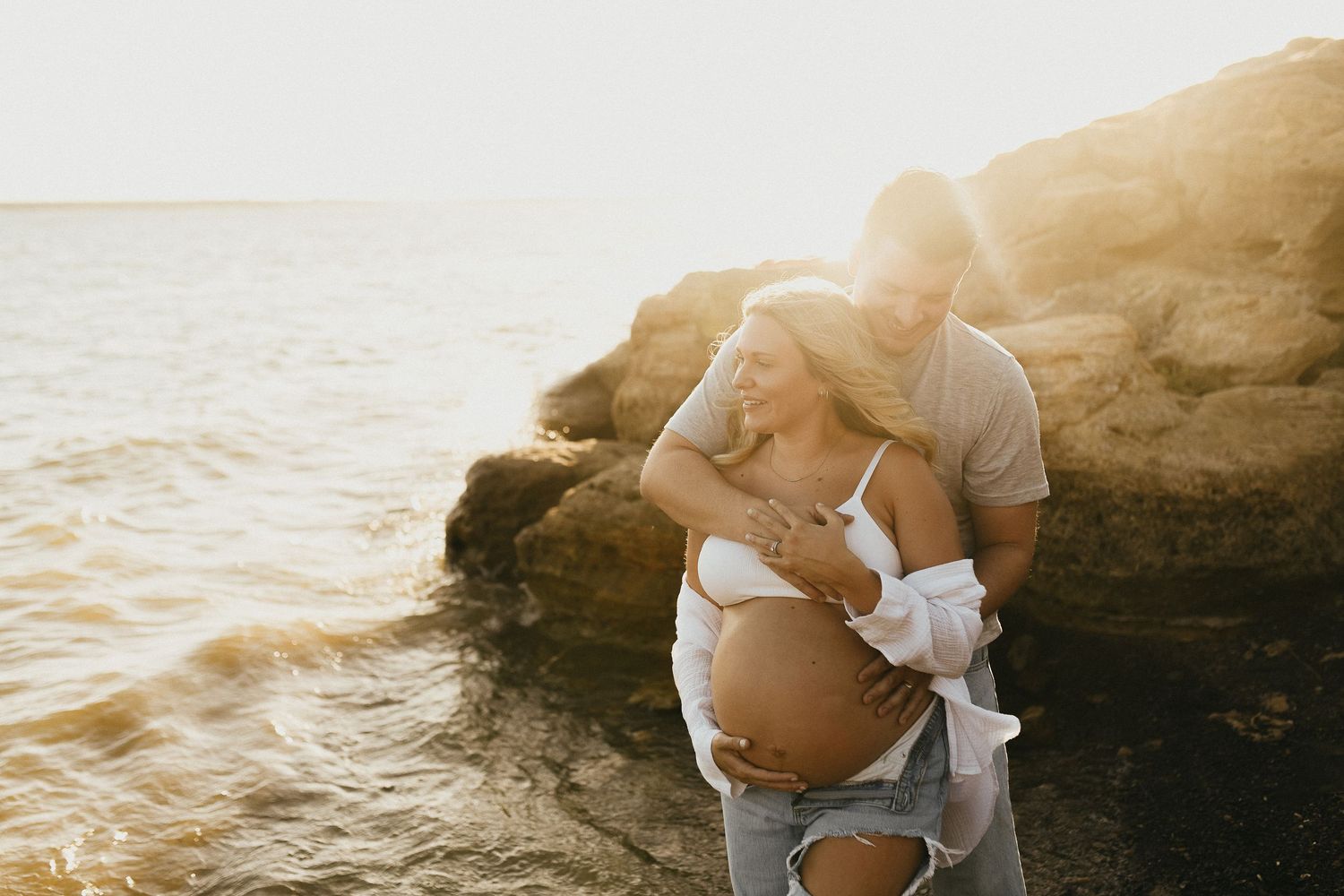 Mom and dad sharing a quiet moment during their Flower Mound maternity session