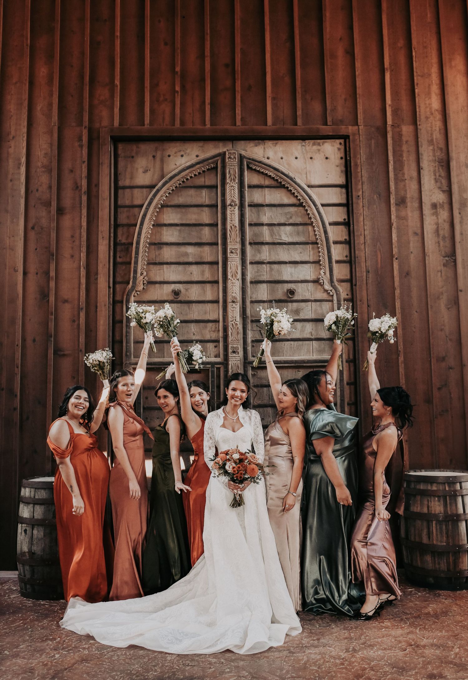 Fall wedding bridesmaids in romantic mismatched autumn dresses