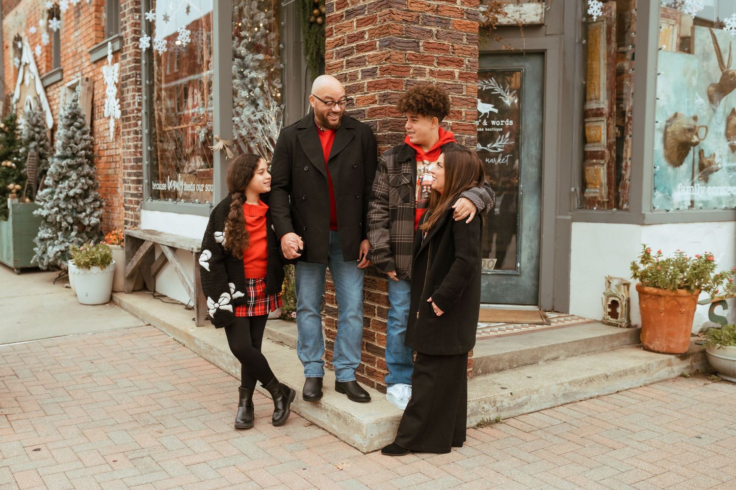 Family enjoying a Christmas photo session in Downtown McKinney