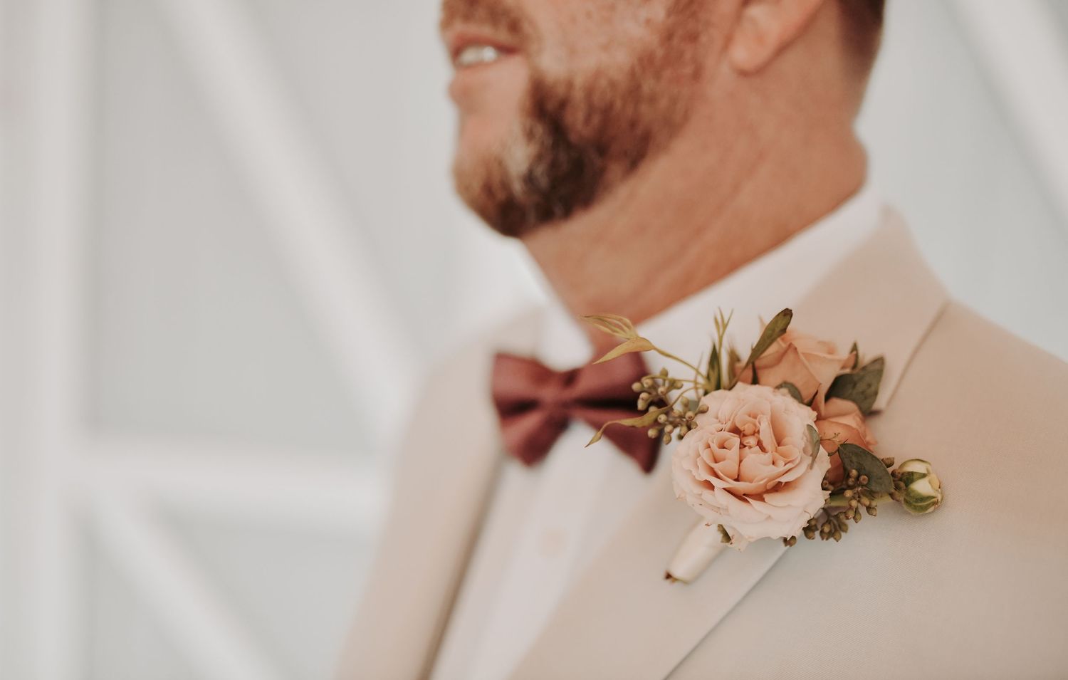 Groom dressed in a light neutral suit for a romantic North Texas wedding