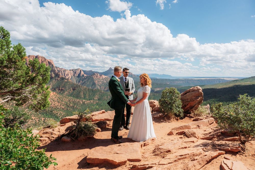 Couple exchanges vows at a stunning red rock overlook in Sedona, Arizona with sweeping canyon views.