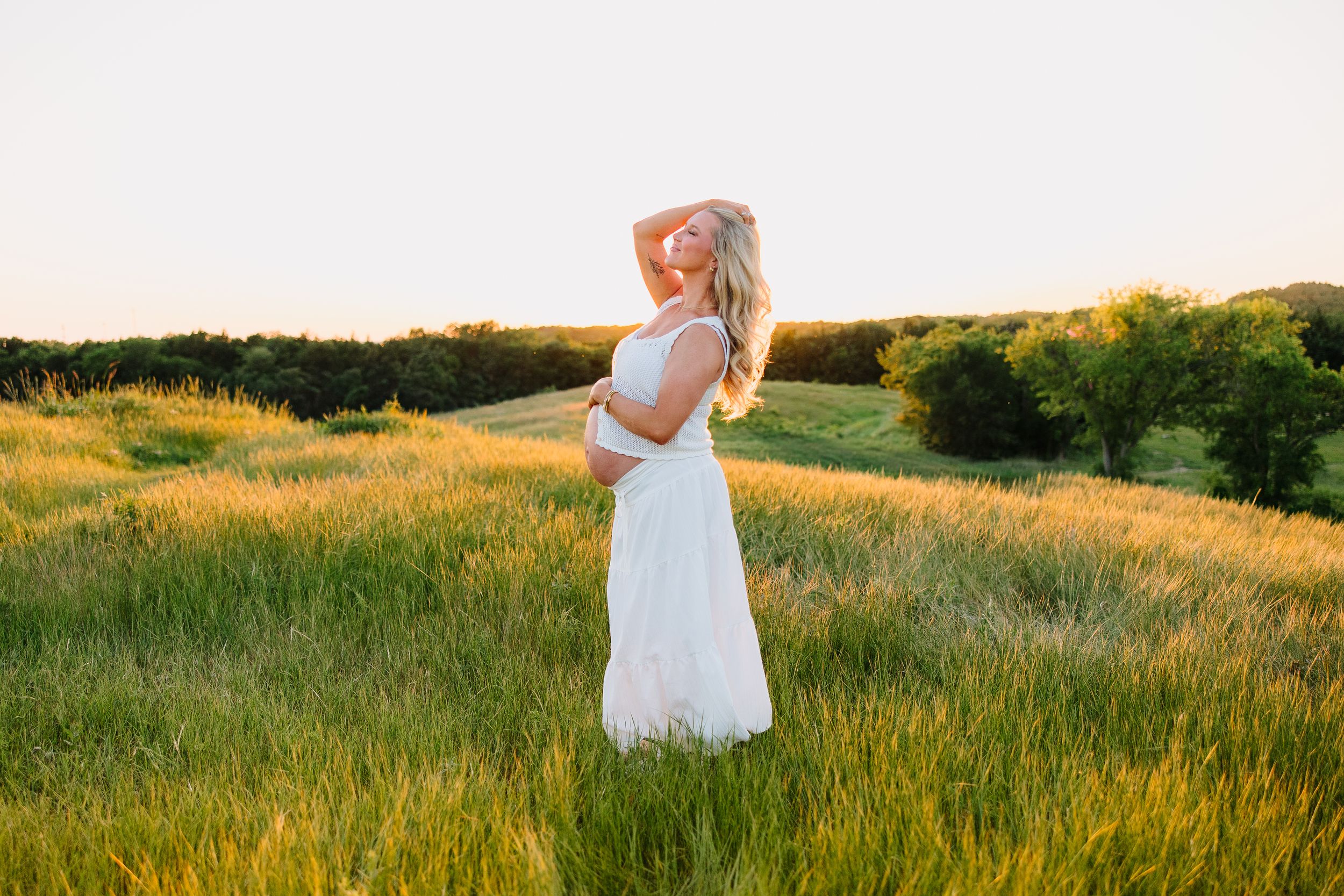 Belly bump photo during a golden hour maternity session.