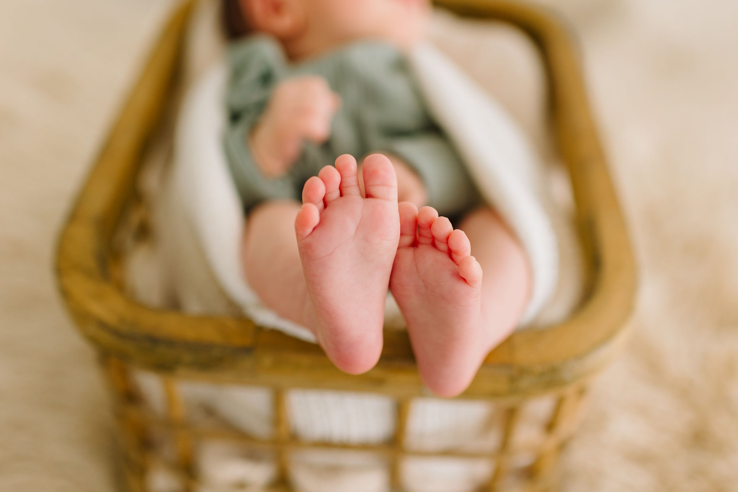 Tiny toes during a lifestyle newborn session in studio.
