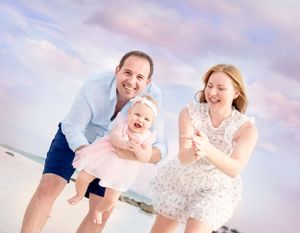 Sunset family beach portrait on Anna Maria Island — natural light photography by local Siesta Key and Anna Maria beach photographer