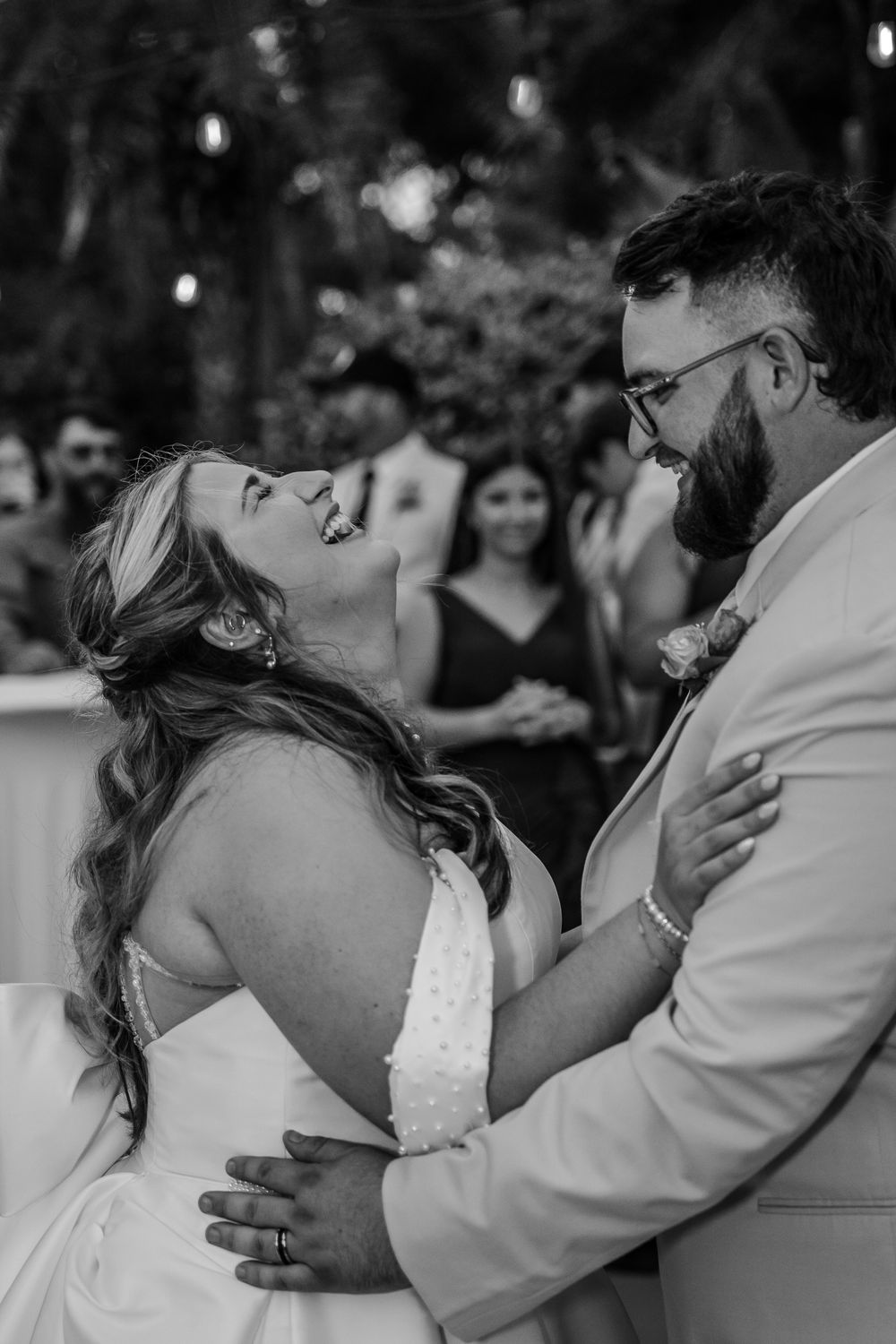 A romantic sequence of black and white wedding photos showing a couple sharing tender kisses during their special day.