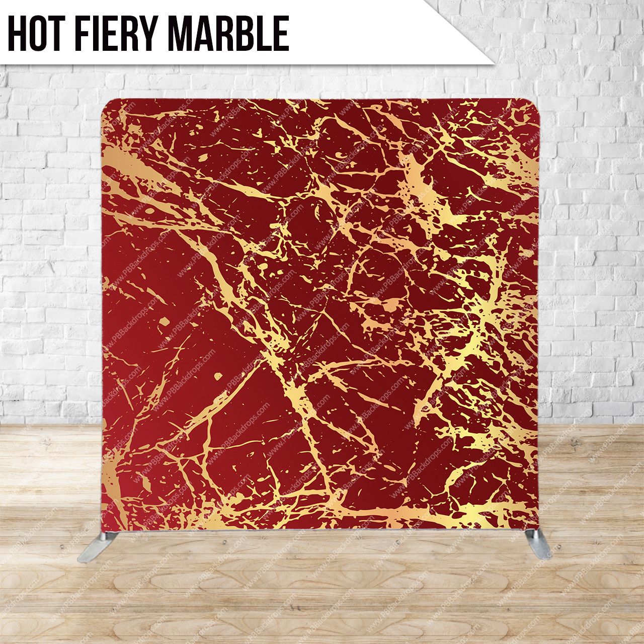 Red marble surface with intricate gold veining patterns displayed against white brick wall background.