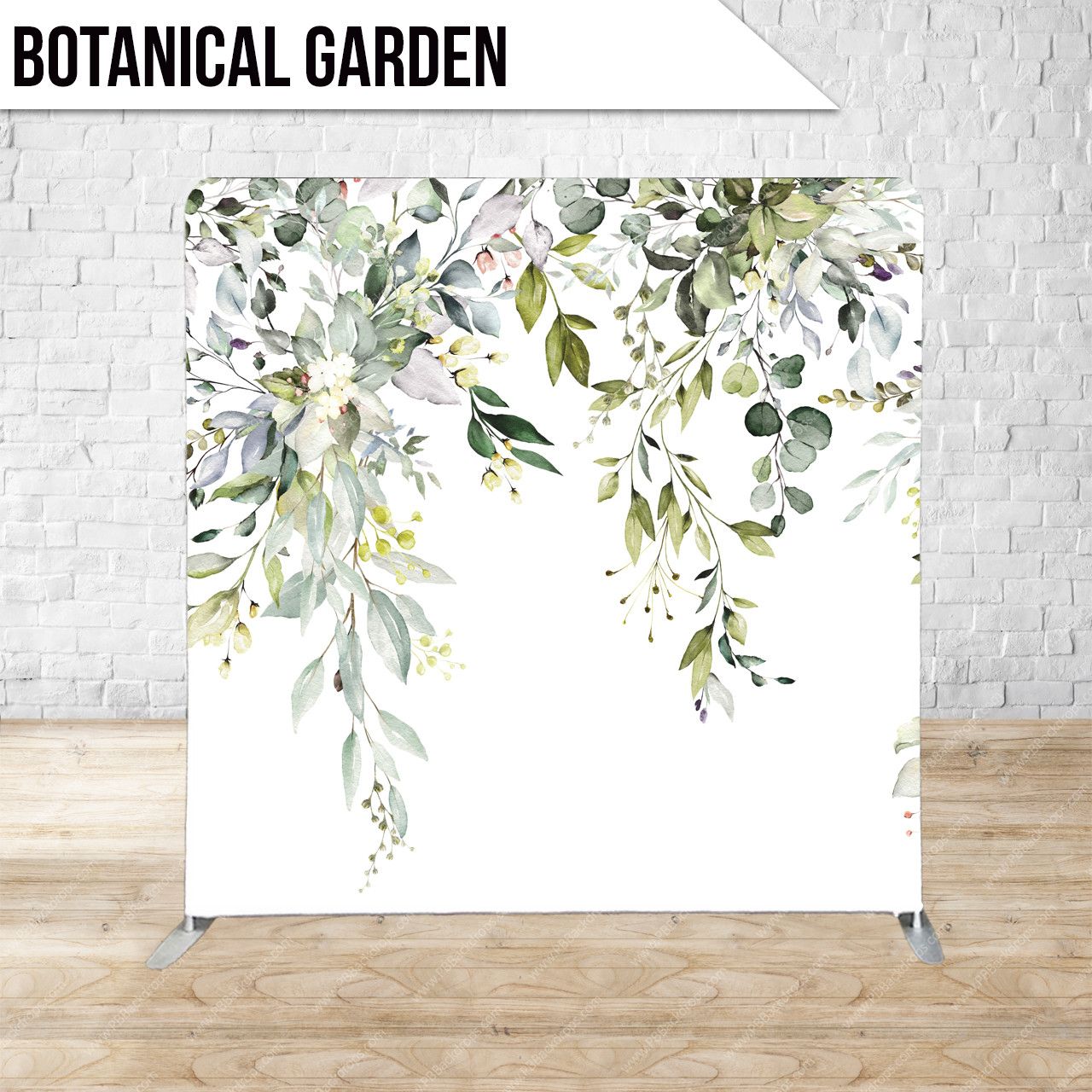 White and green floral backdrop display with eucalyptus leaves and delicate botanical elements against a white backdrop.