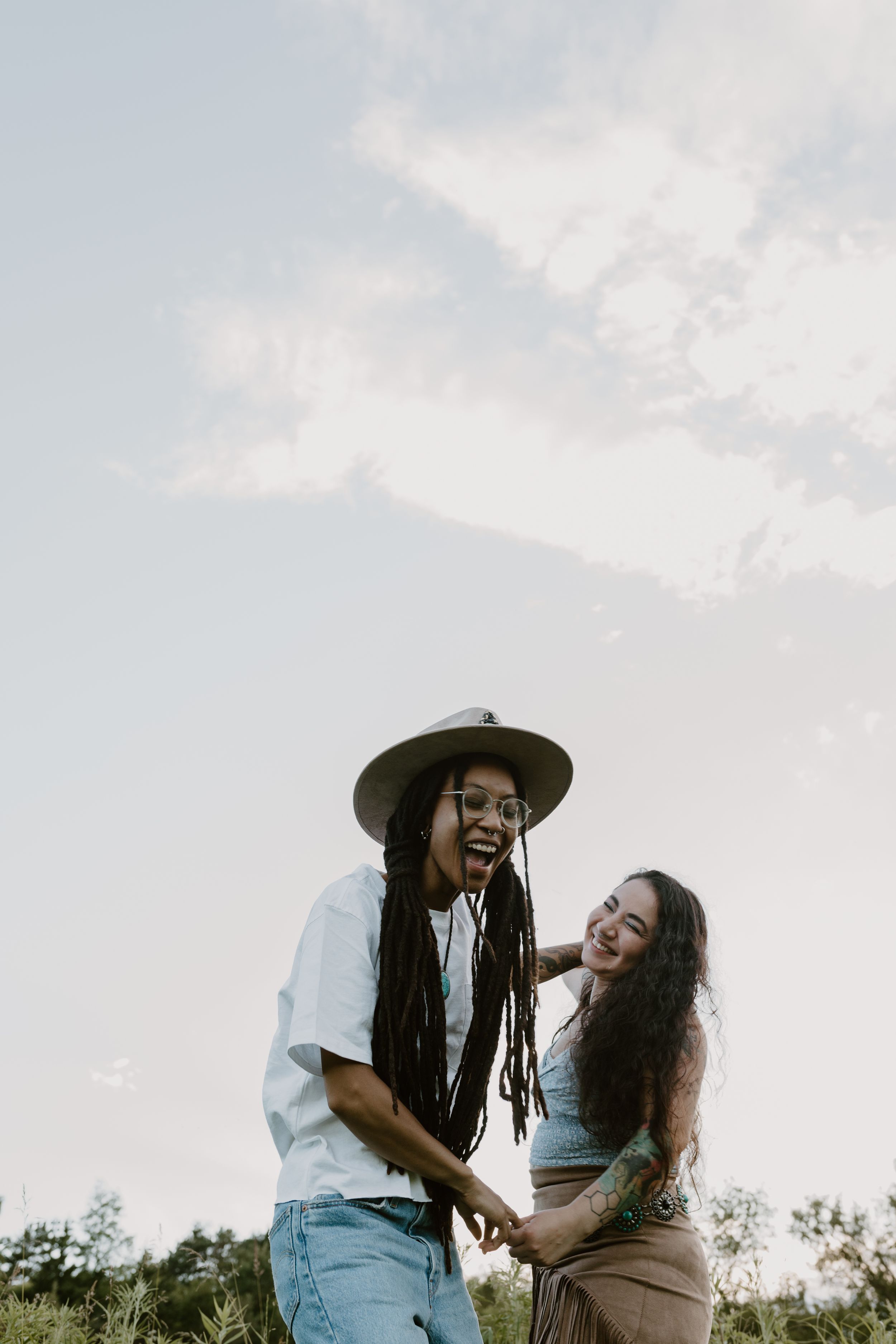 Friends share laughter while enjoying a summer day outdoors.
