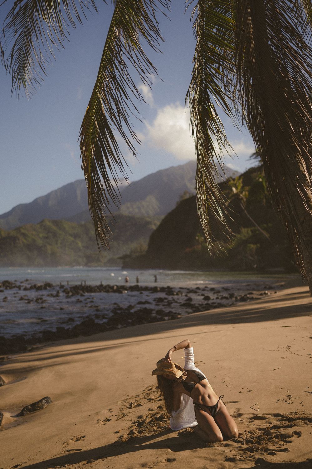 Model posing with palm trees on Kauai
