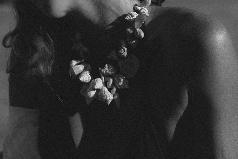 Model wearing shell necklace on Kauai
