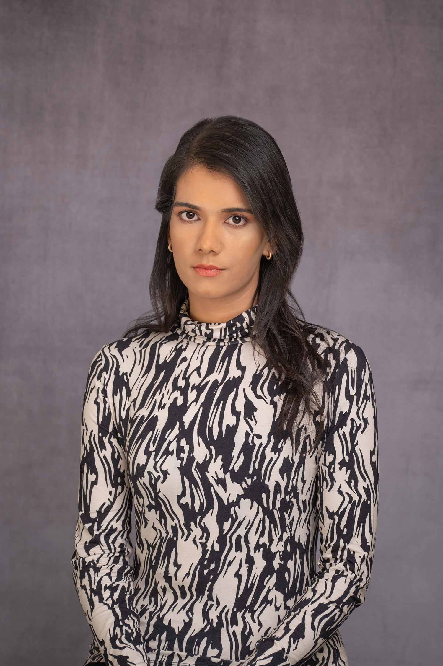 A young lady posing for a headshot photograph