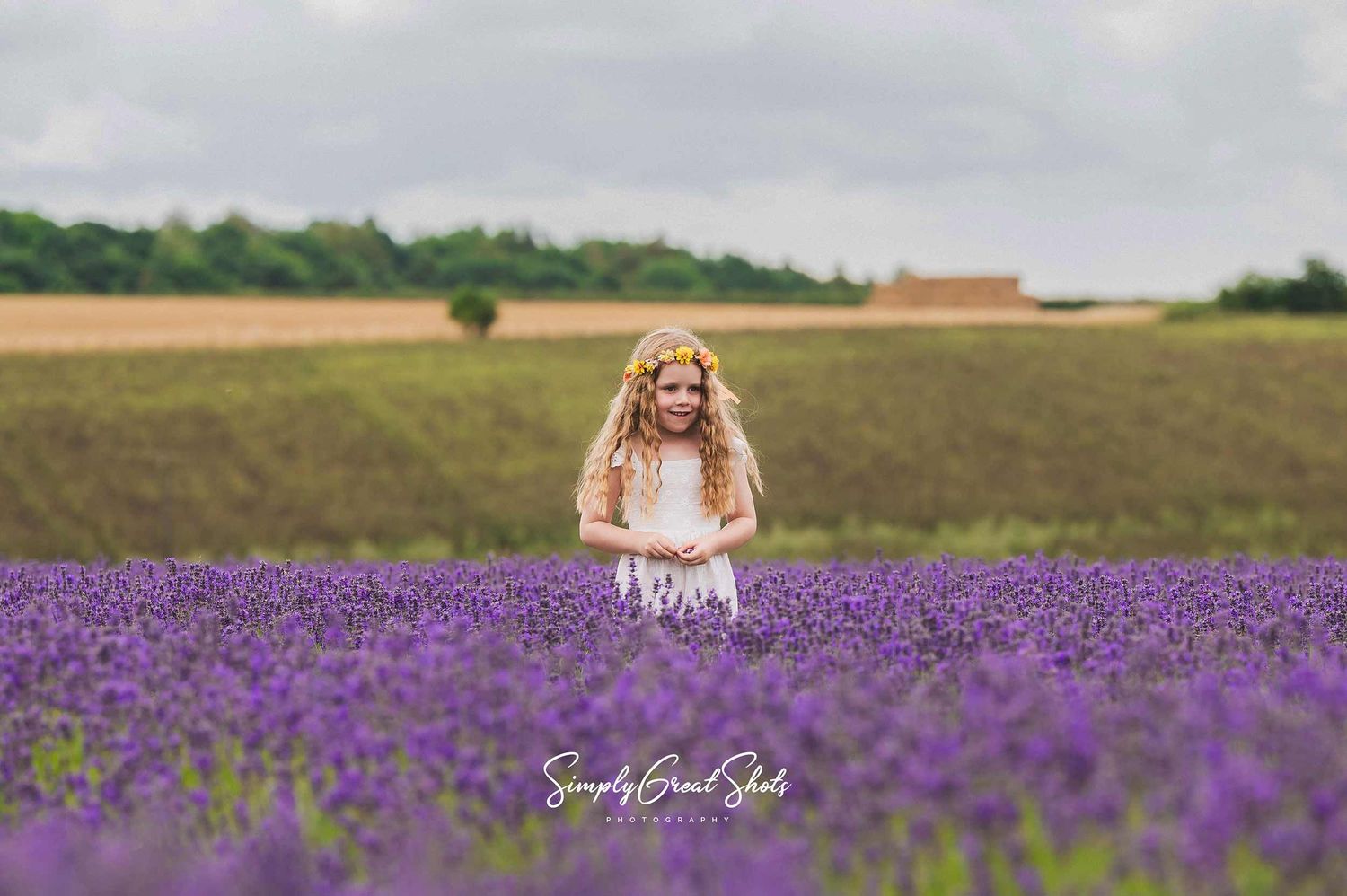 SimplyGreatShots Portrait Photography - A young girl plays in a lavendar field