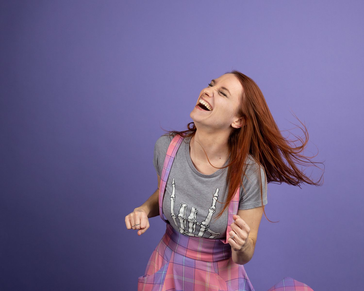 Energetic movement shots in purple dress against lavender background.