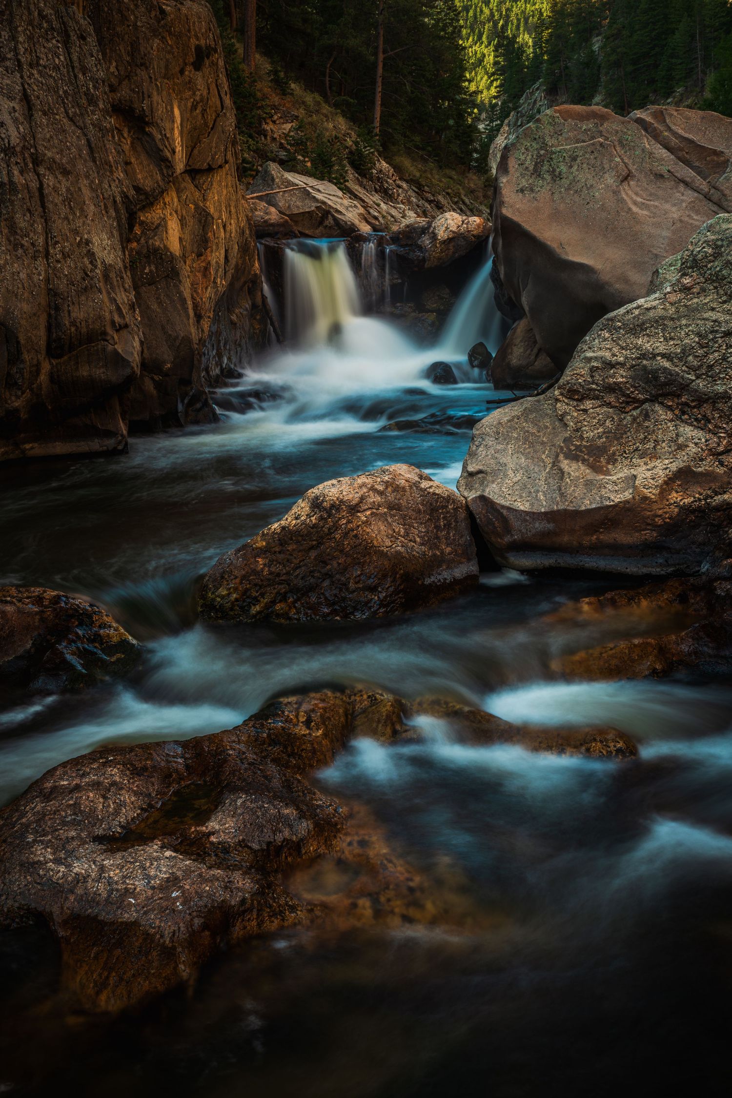 Fine art nature landscape photography, river and waterfall long exposure in a Northern Colorado canyon.