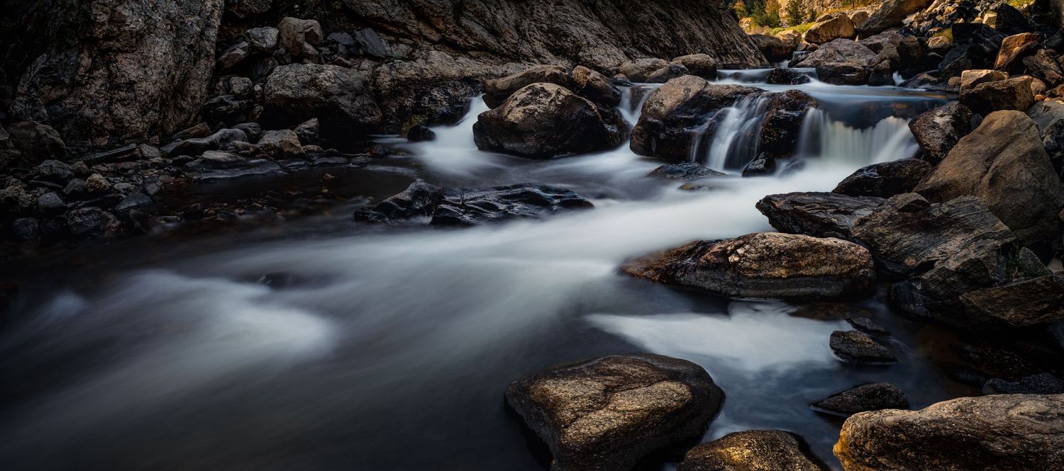 Fine art nature landscape photography, river and waterfall long exposure in a Northern Colorado canyon.