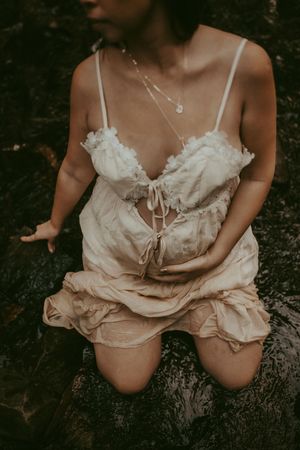 Intimate boudoir photography featuring vintage-style white lace lingerie.
