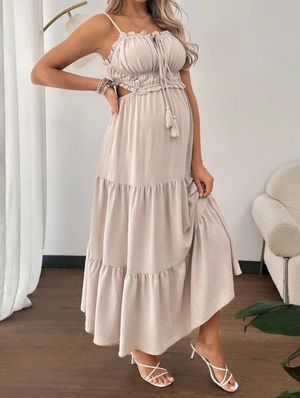 Beige tiered maxi dress with adjustable straps shown from multiple angles on hardwood floor.