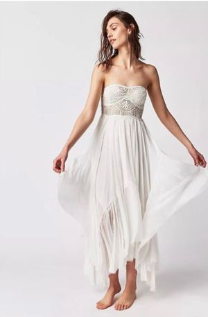 Ethereal white dress with flowing fabric photographed in a series of graceful movement poses.