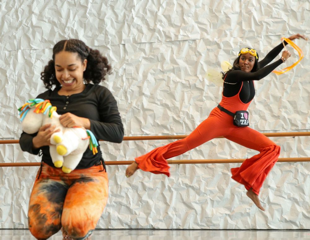 A dynamic sequence of dance movements shows a performer in orange and black attire leaping and spinning gracefully.