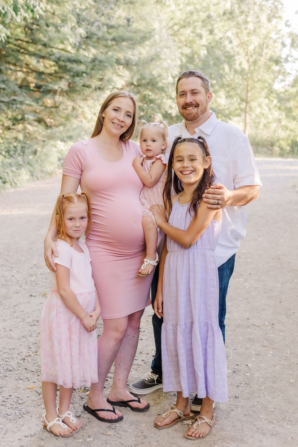 family with three little girls and baby walking in a regional park in Sonoma County California. maternity session. what to war.