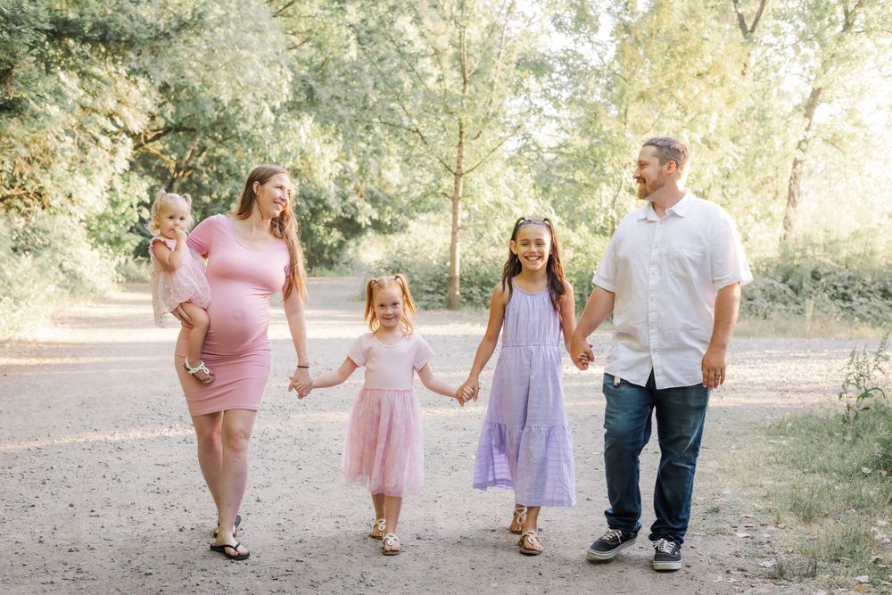 family with three little girls and baby walking in a regional park in Sonoma County California. maternity session. what to war.