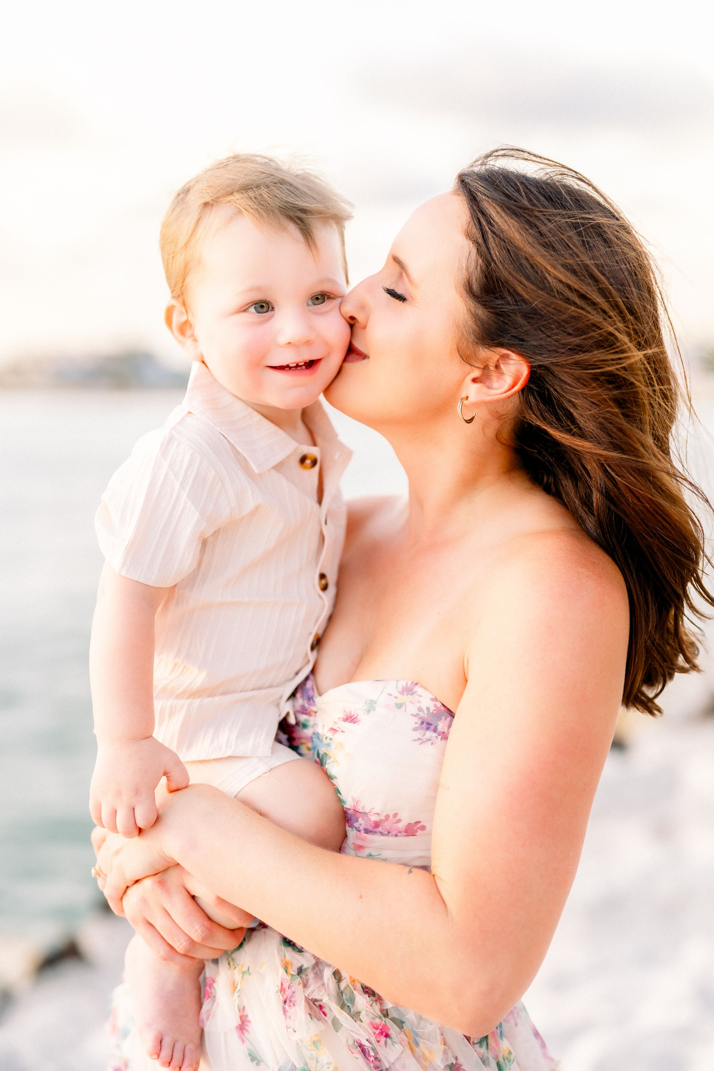 kisses for baby boy from mom during a family photoshoot on St. Pete Beach