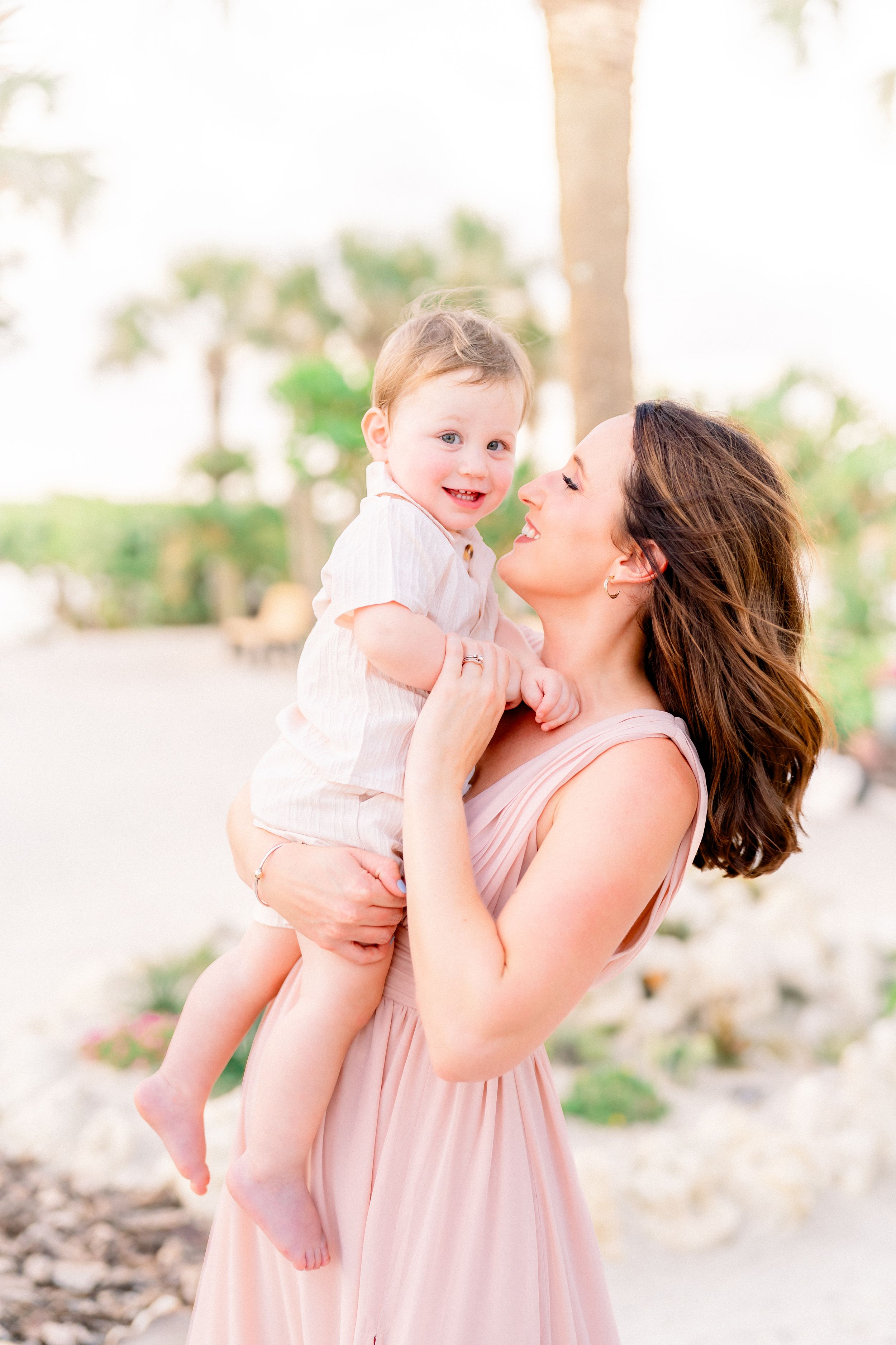 dancing with mom during a family session on St. Pete Beach photoshoot